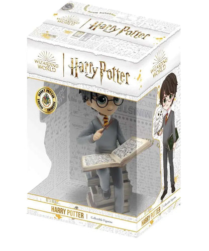 HP HARRY ON PILE OF SPELL BOOKS FIGURE