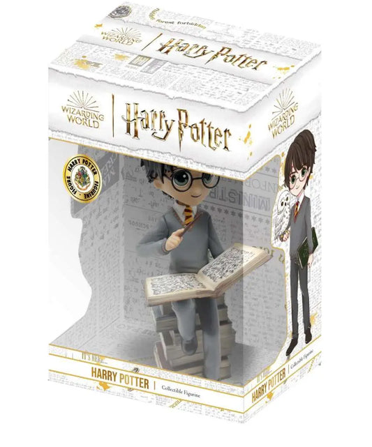 HP HARRY ON PILE OF SPELL BOOKS FIGURE